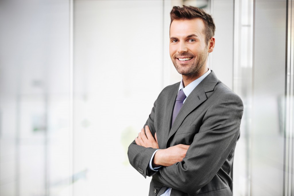 Businessman posing with his arms crossed