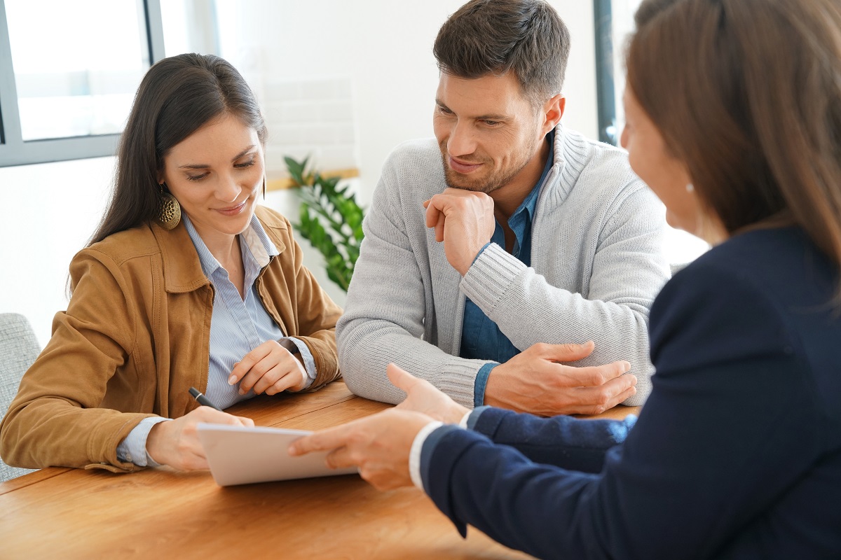 couple reading a document from agent