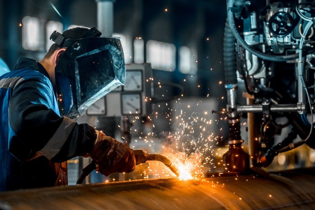 welder wearing protection mask while working