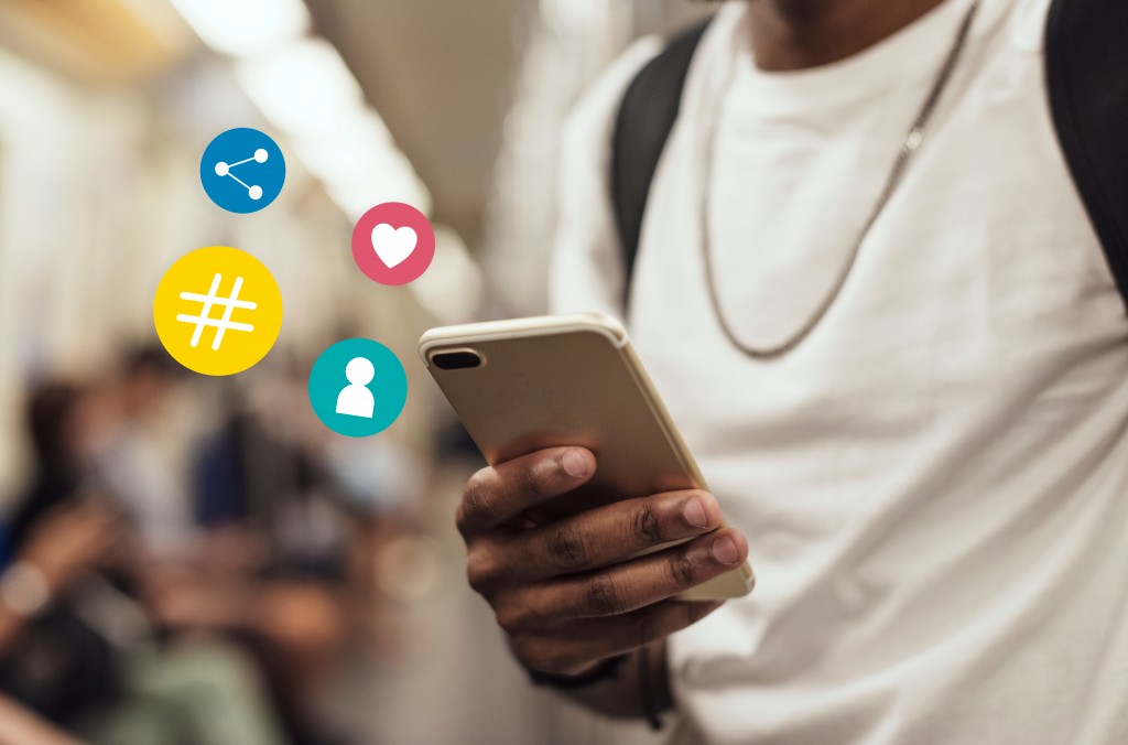 Man looking at social media using his phone