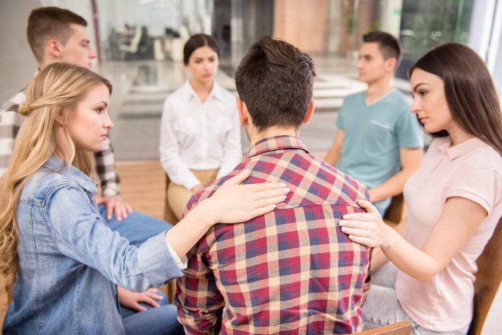 man talking to his support group