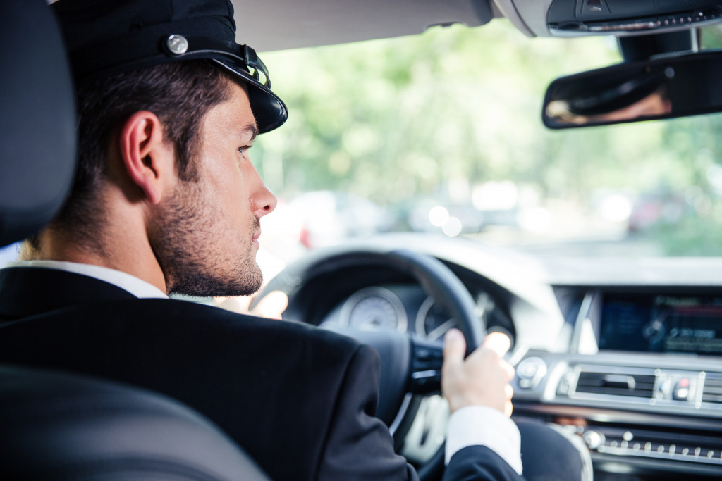 chauffeur riding car