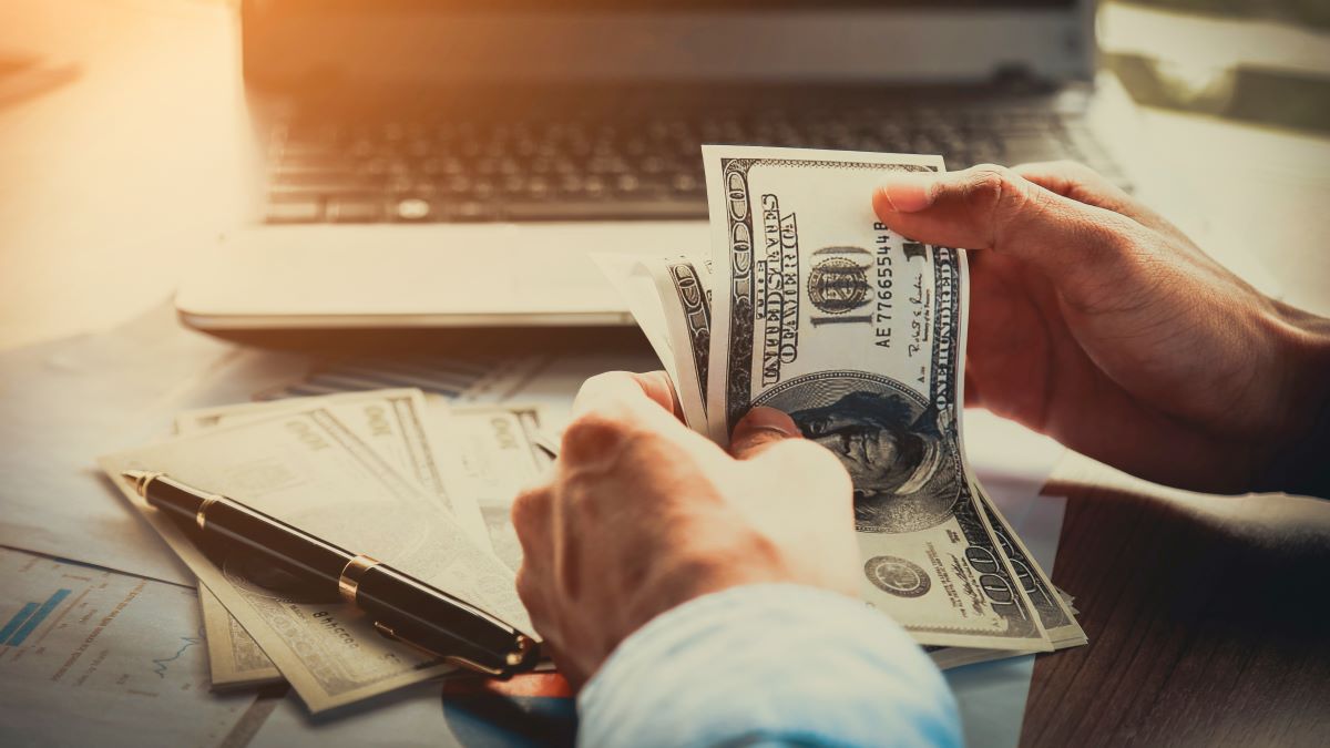 man counting cash