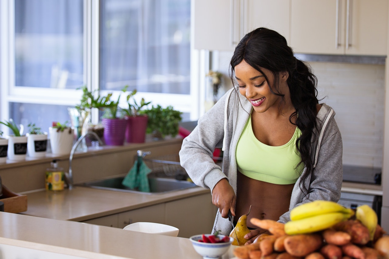 fit woman preparing food