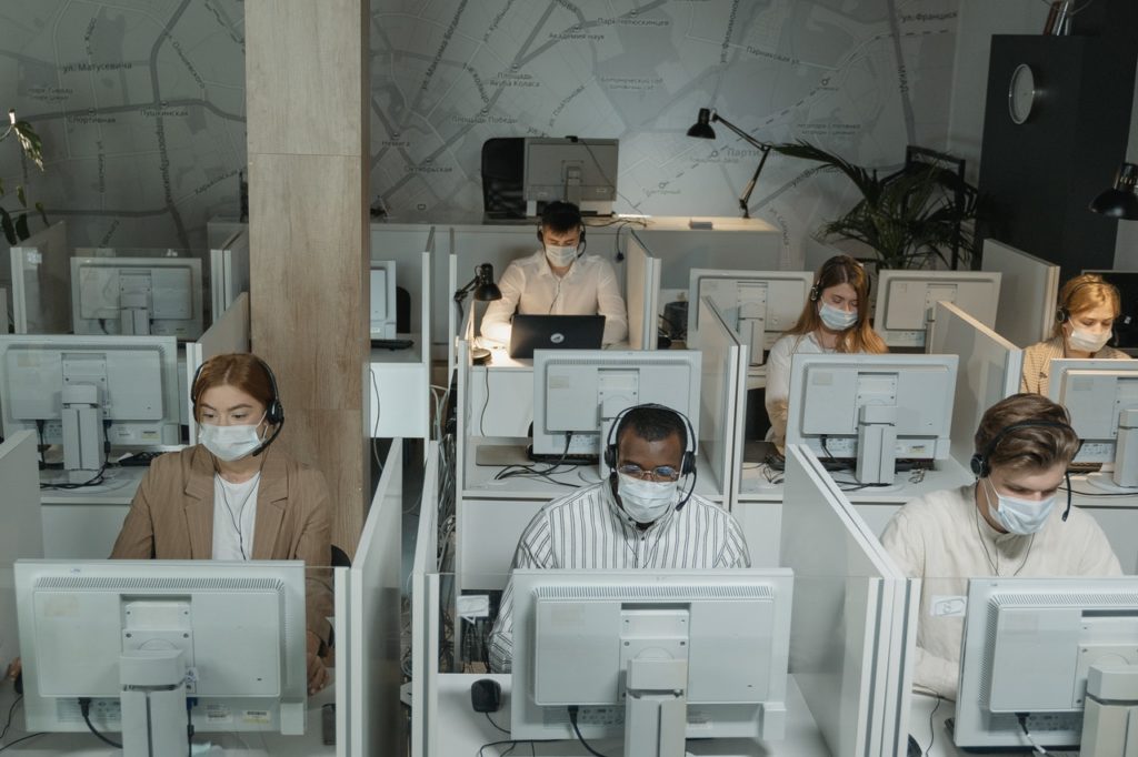 employees working wearing facemasks