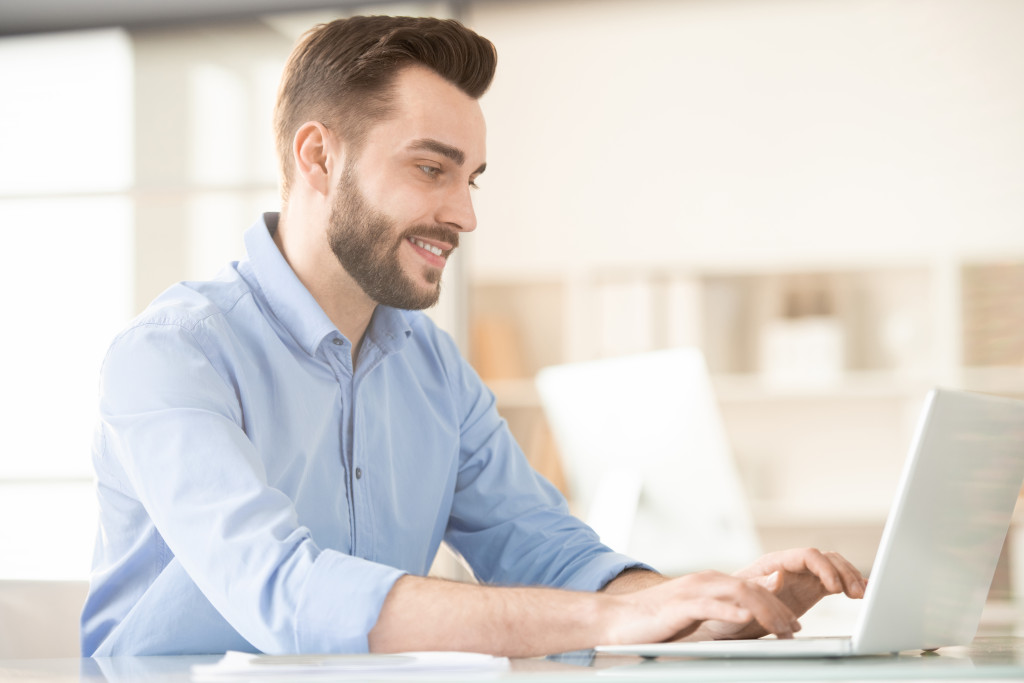 man using laptop