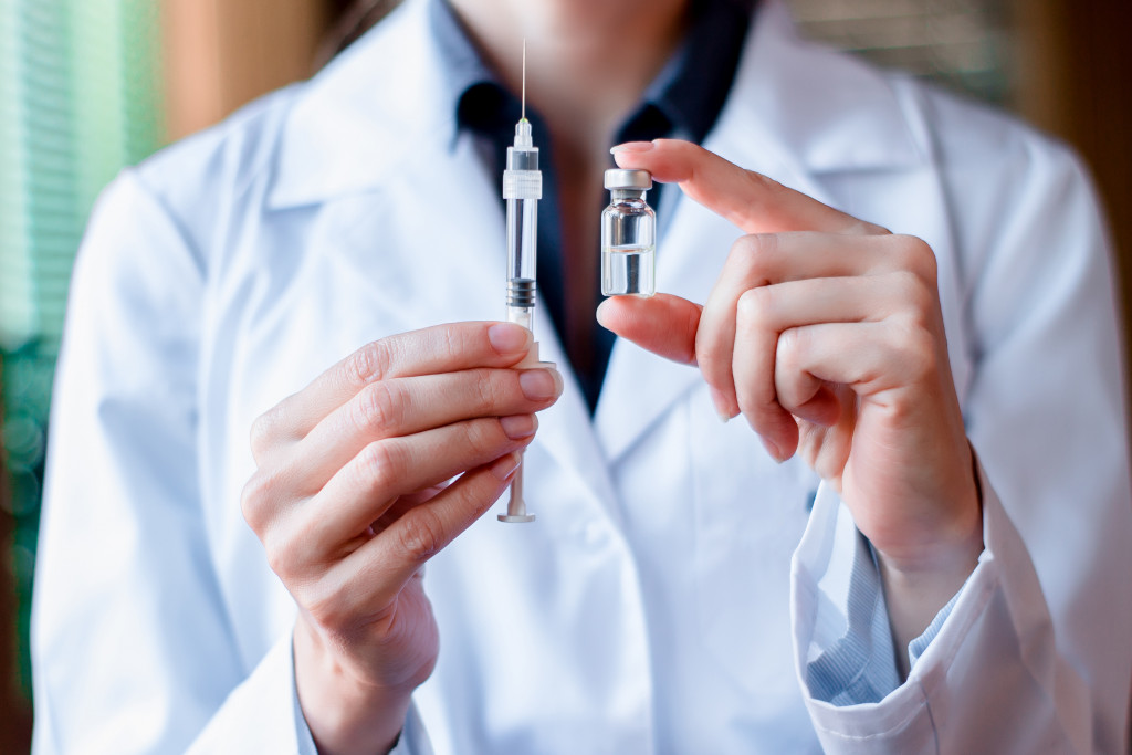 doctor with vaccine vial