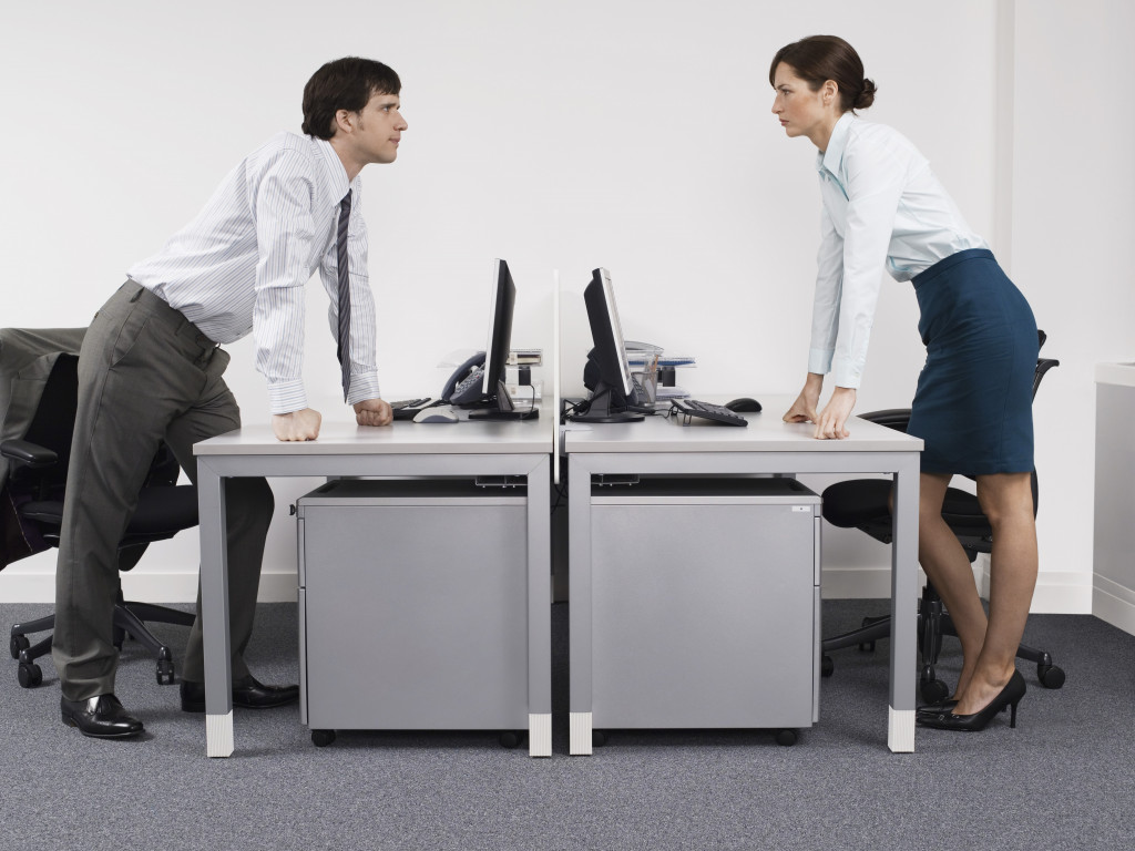 woman and man staring down in the office