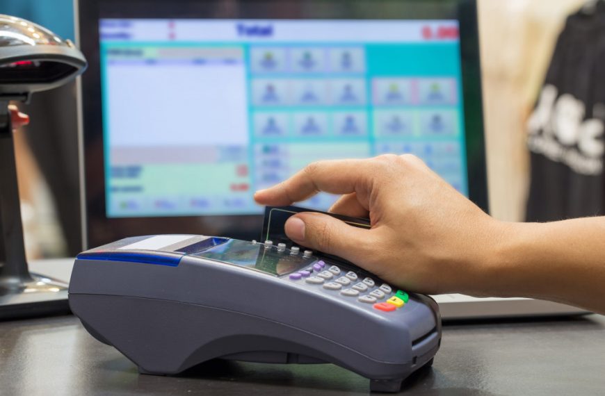 Hand Swiping Credit Card In Store