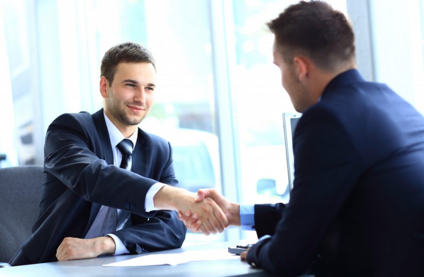 businessman shaking hands to seal a deal with his partner