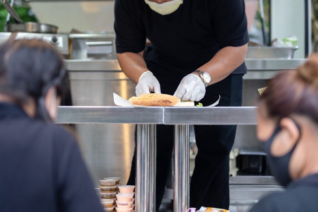 A chef preparing a meal in the food truck
