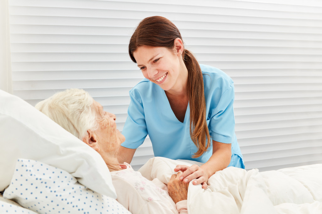 A home nurse taking care of a senior at home