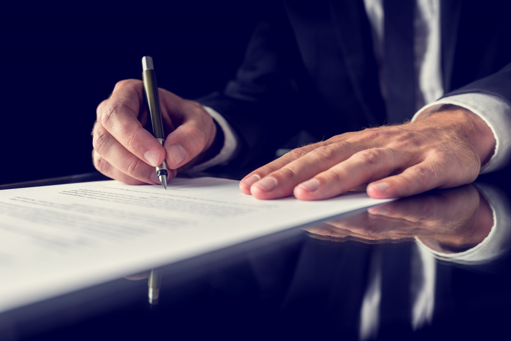 A person signing a contract