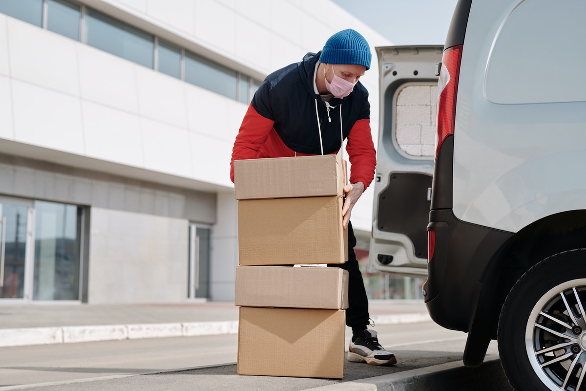 man loading boxes to be shipped