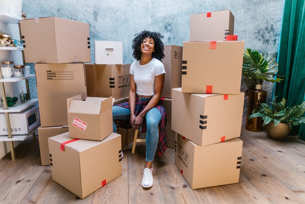 woman surrounded by boxes