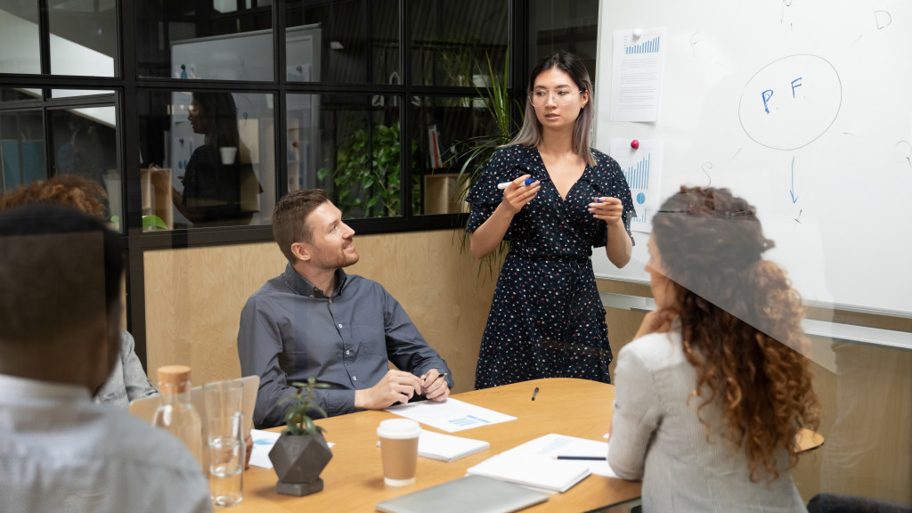 businesswoman speaking at meeting in office space