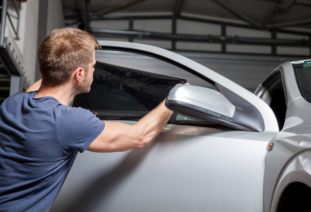 A man installing protection film