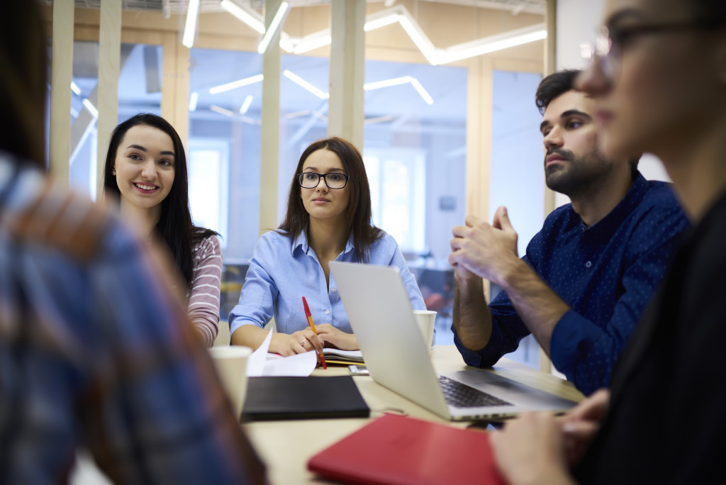 employees in a meeting listening to each other