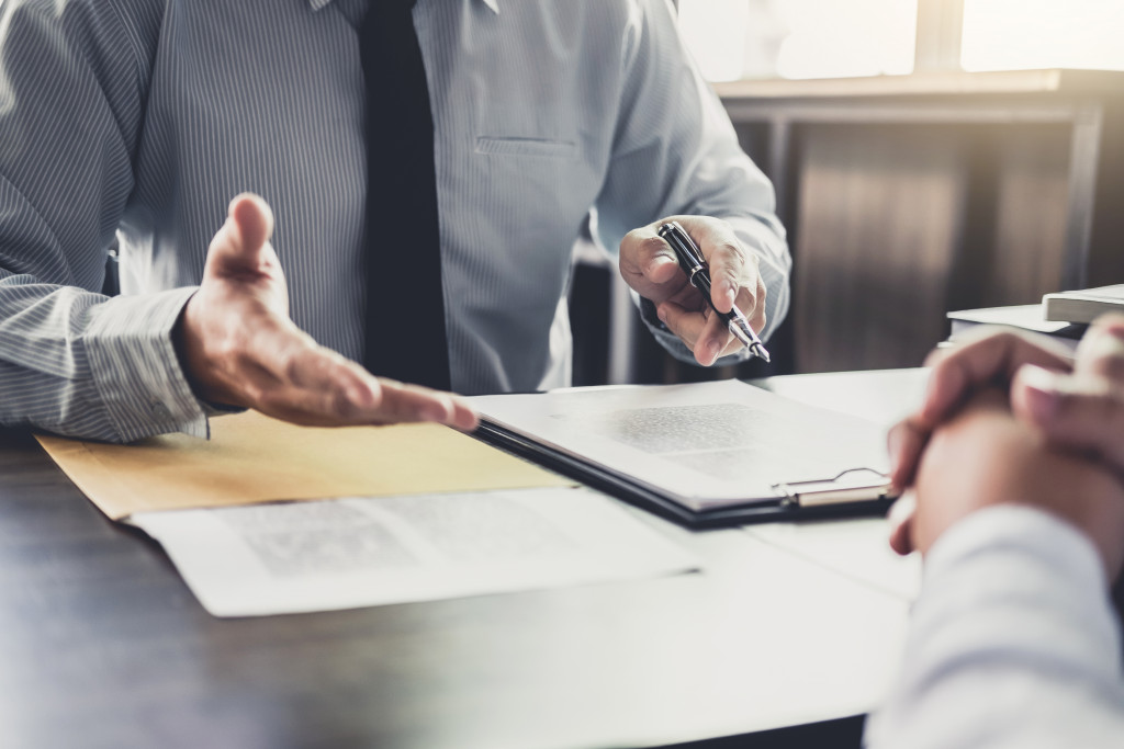 an employee listening to a lawyer discussion