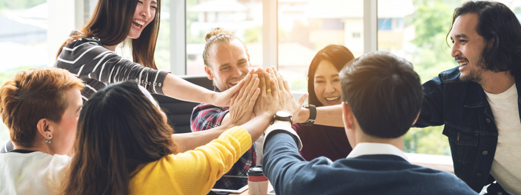 Happy employees working together