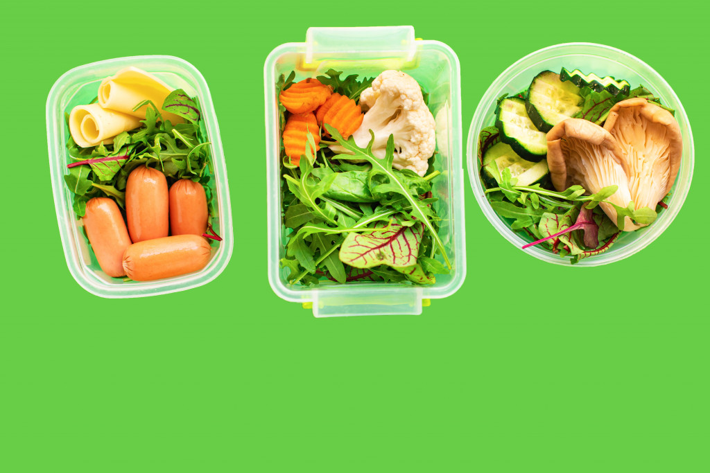 Healthy meals in three containers for a daily diet.
