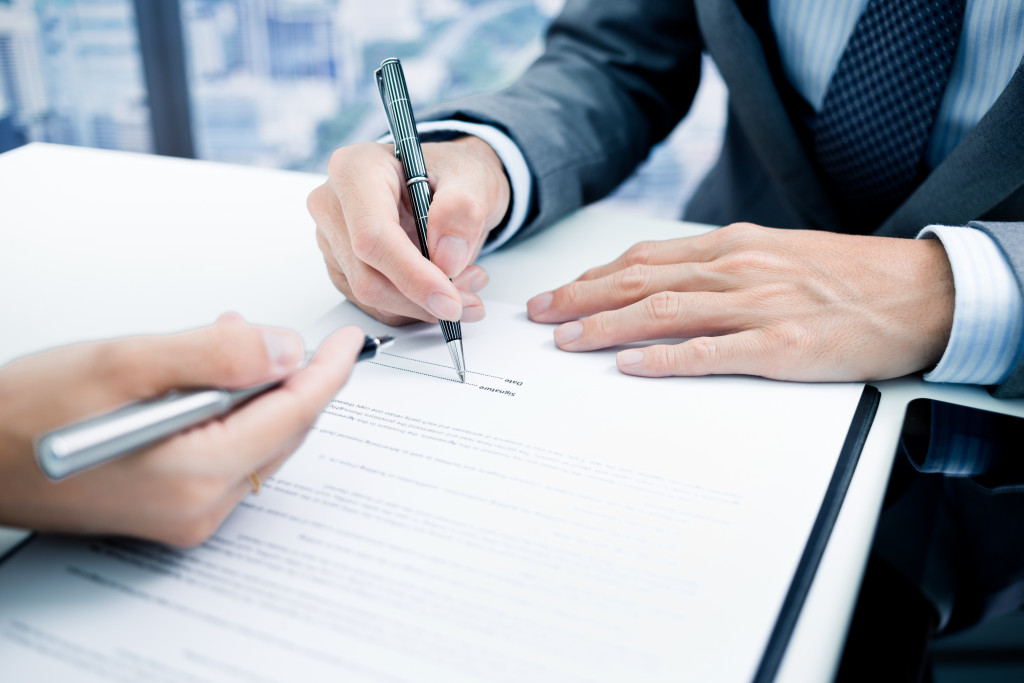 businessman signing a document