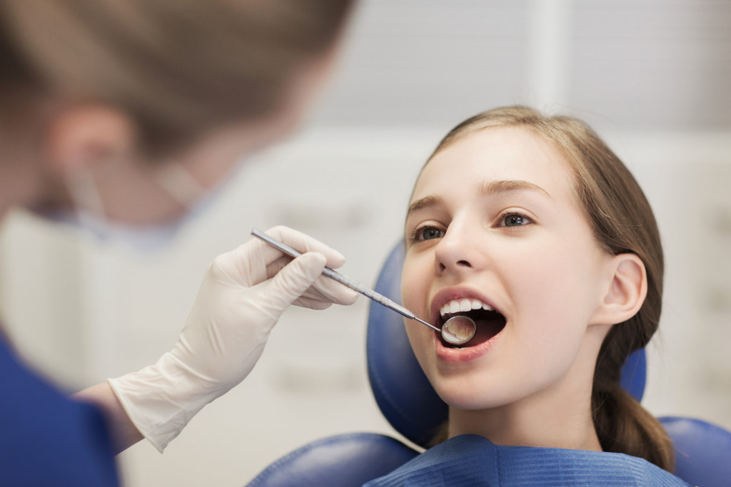 Kid in regular dentist appointment