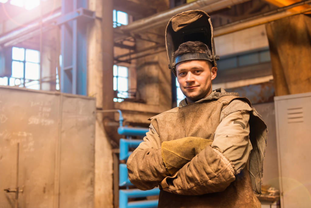 man in factory with protective workwear