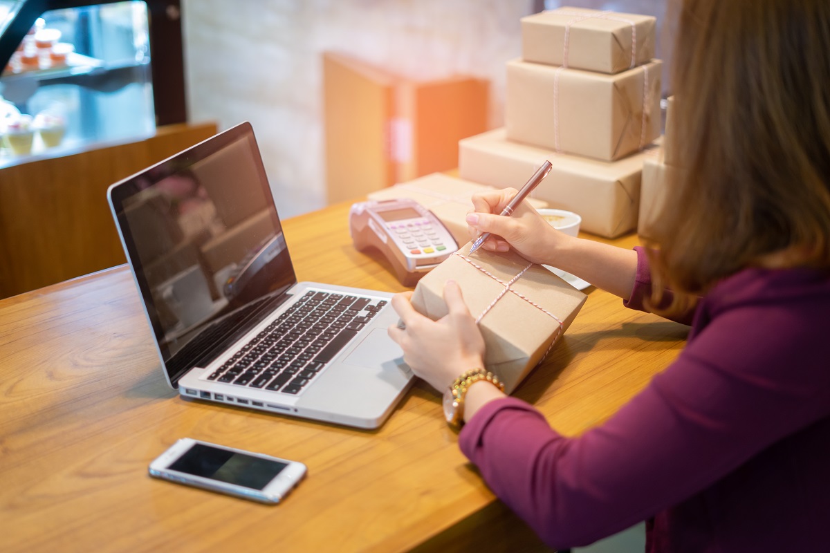 woman preparing packages for shipment