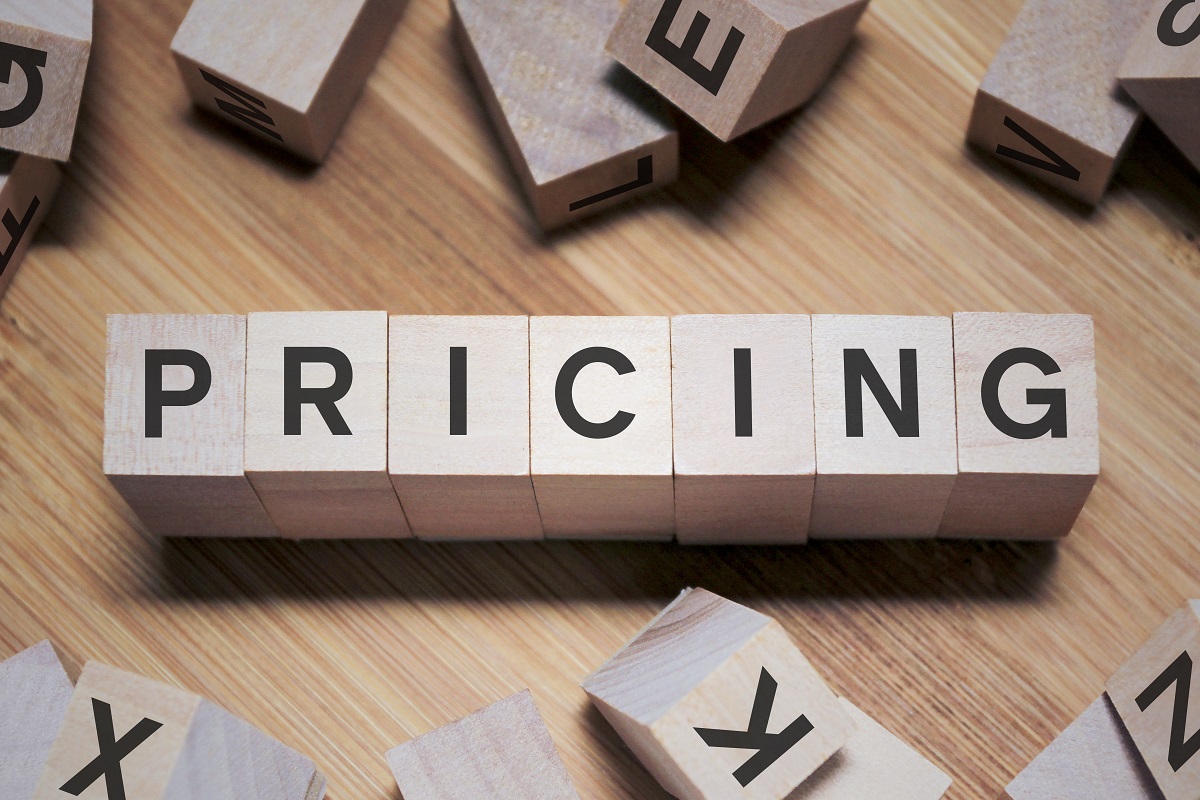 pricing word written in a wooden cube