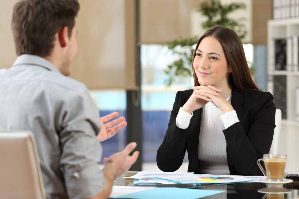 man talking and woman listening