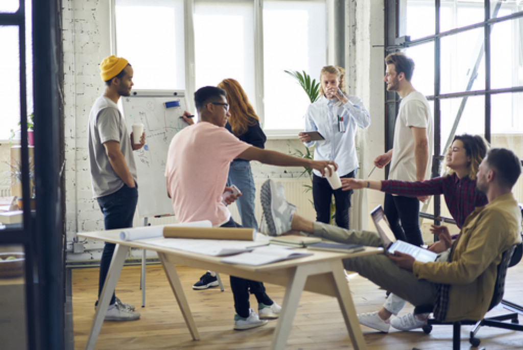 Young employees working on a project at an office.