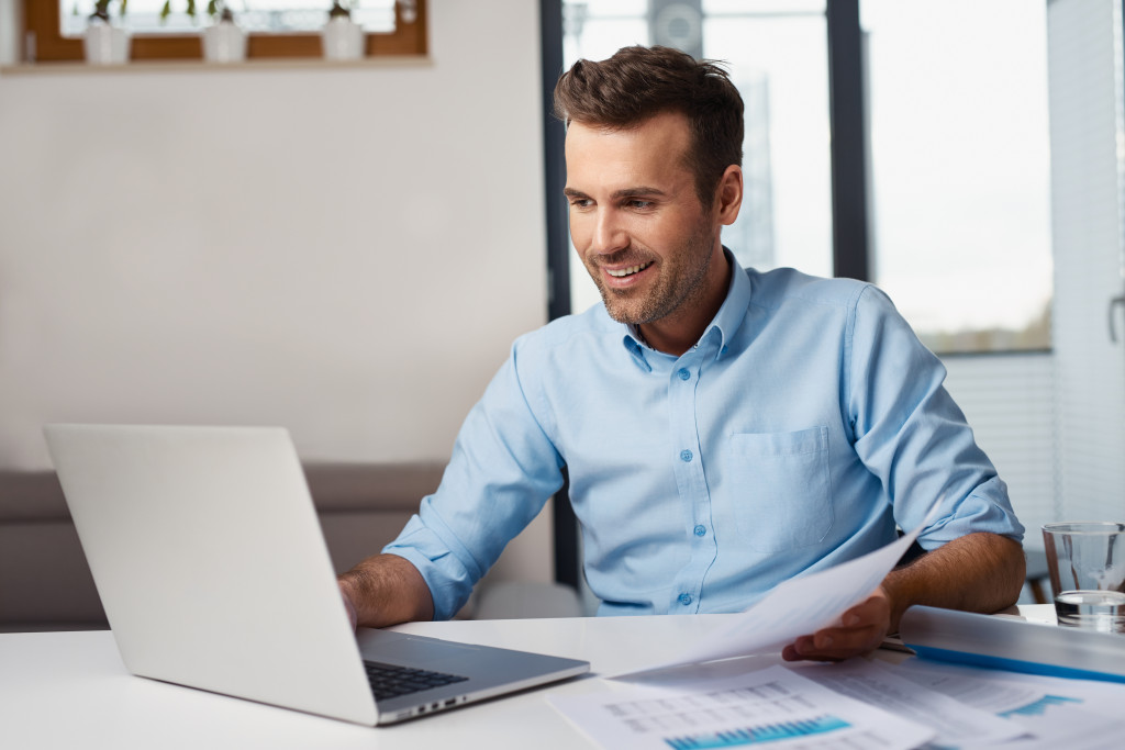 smiling businessman working in his desk