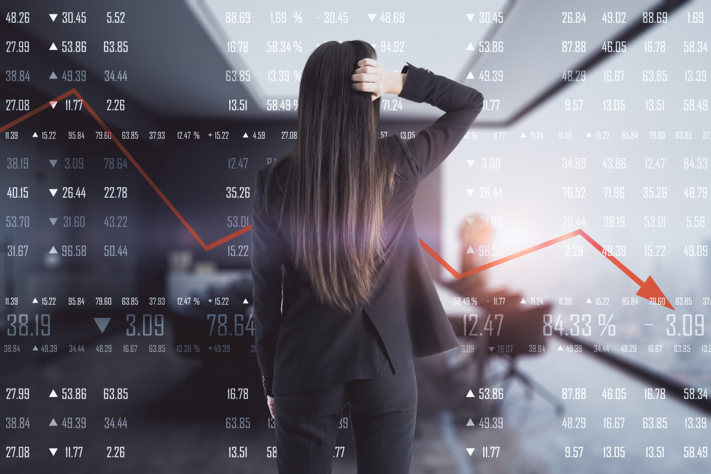 woman looking at a volatile market data