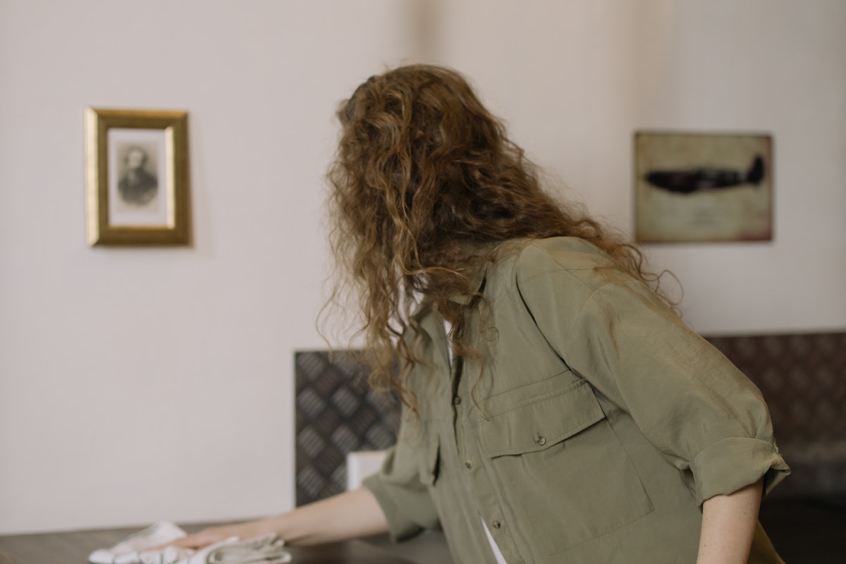 Woman in Brown Shirt Sitting on Chair