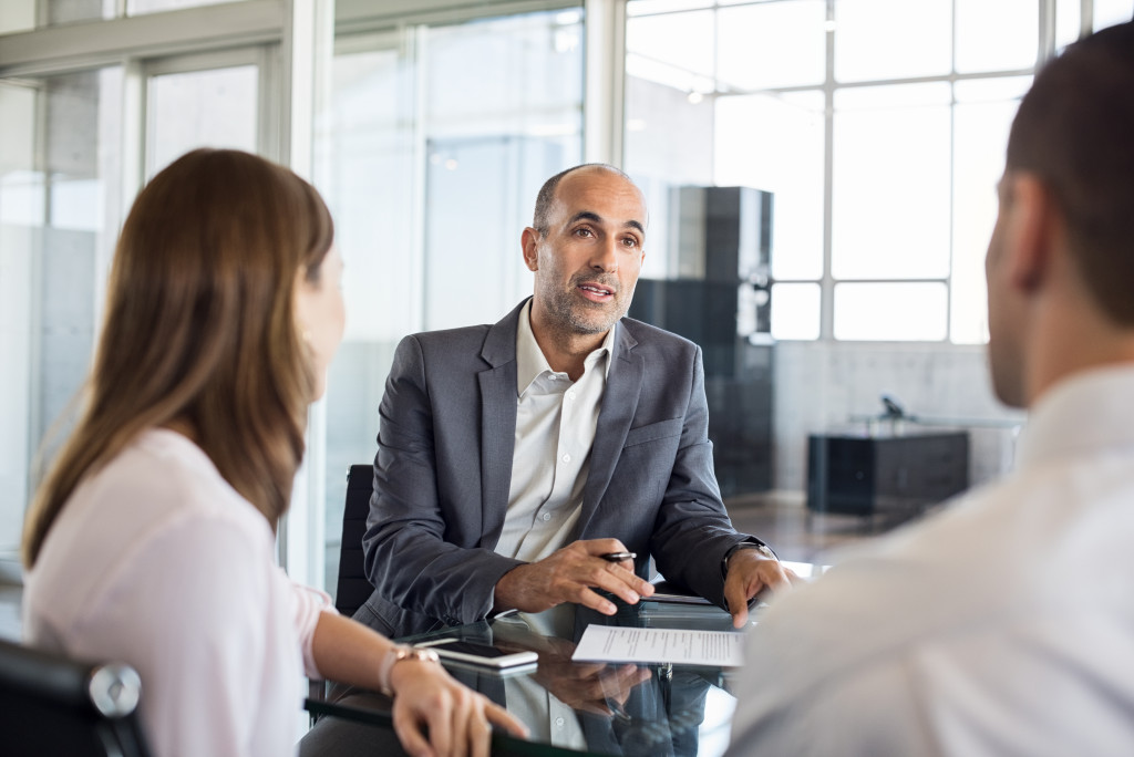 Business owners consulting an insurance professional.