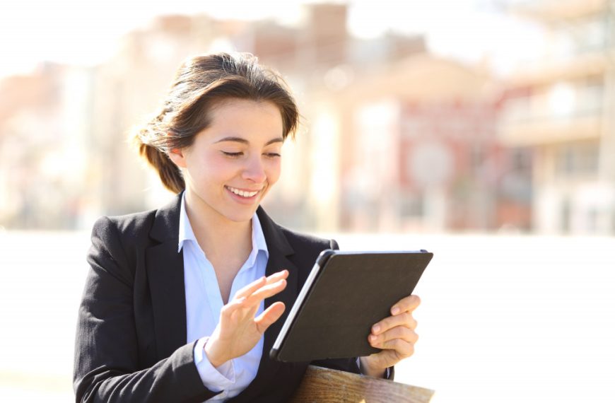 female entrepreneur using a tablet outdoors