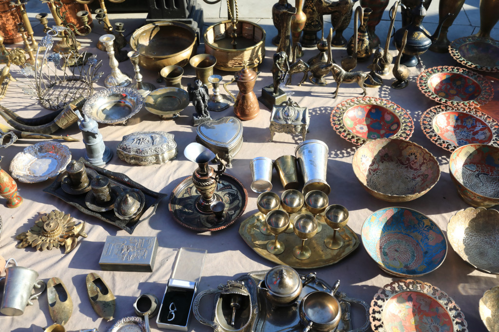 buying antique things laid out in the sun